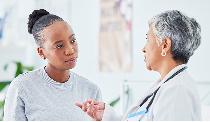 A doctor talks with a patient
