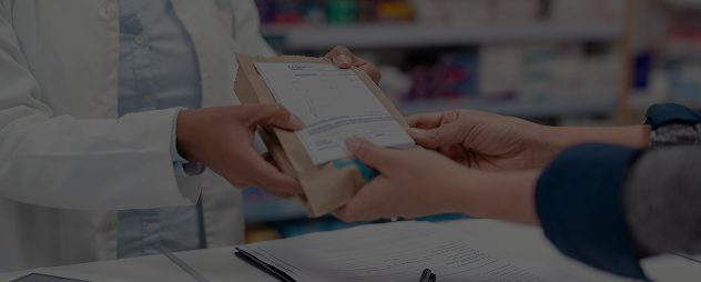 Healthcare provider handing something to a patient in a clinical setting